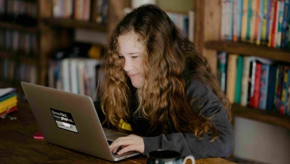 A student completes their scholarship application online