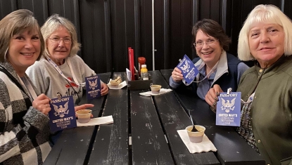 A group of friends shows off their Passports and enjoys a sample during last year's Downtown Restaurant Tour.
